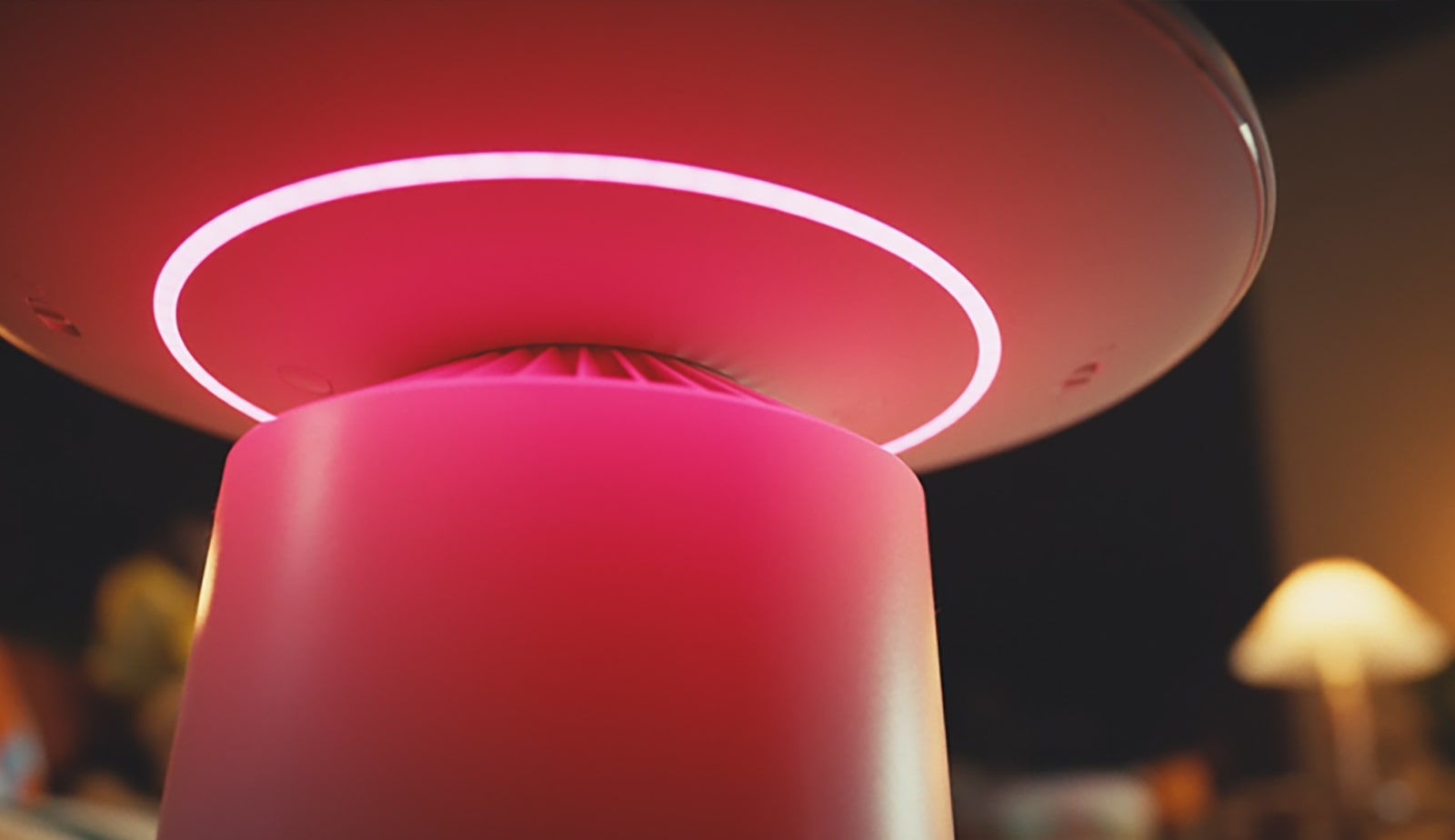 Mood lighting in various colors comes out from the product, illuminating the space subtly. Light control is shown through ThinQ app.